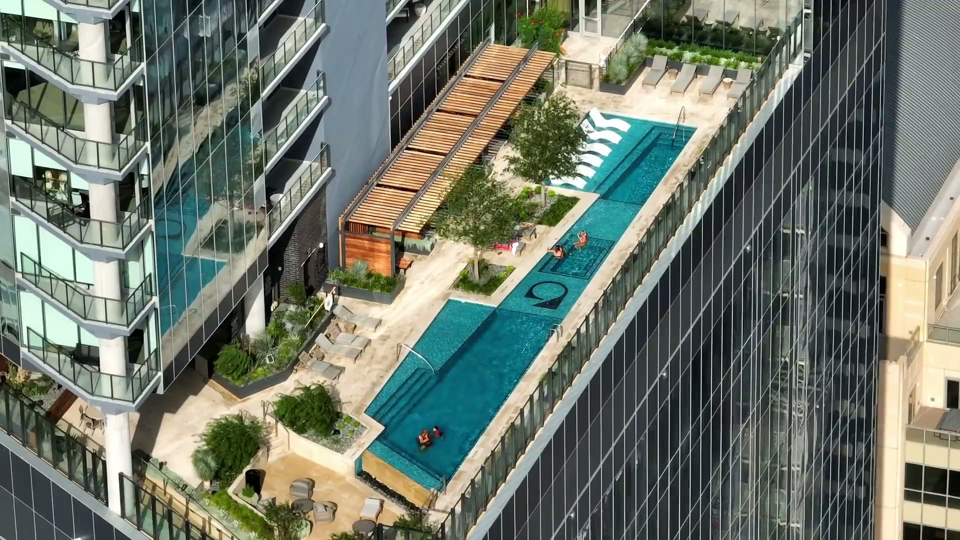 Aerial view of the rooftop pool at Residences at 6G, the large 6 set into the pool floor
